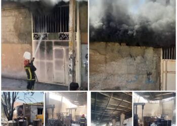 تلاش آتش نشانان شیراز در اطفاء حریق کارگاه انبار رنگ